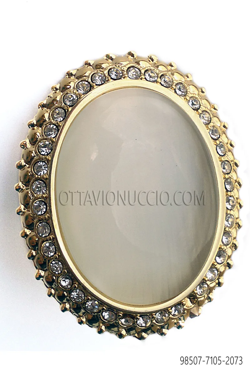 Knot holder with gold cameo and rhinestones