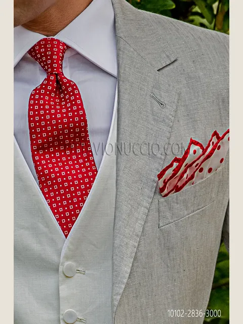 Red silk tie with white patterns