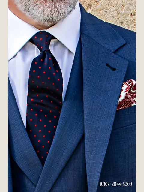 Tie in blue pure silk with red polka dots