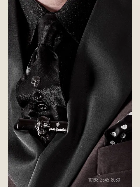 Tie in black lurex with metal appliqués