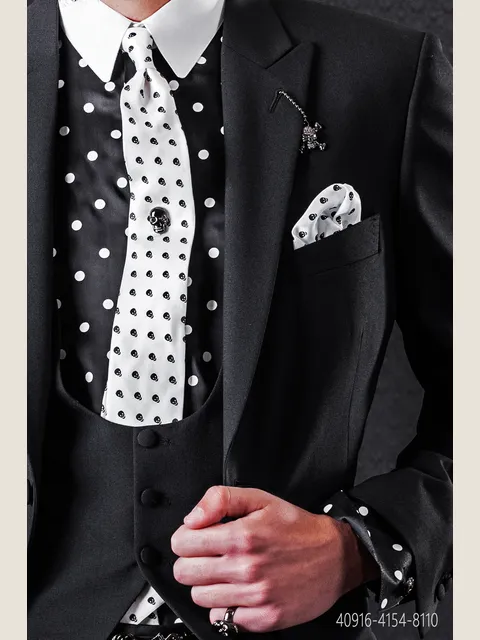Black shirt with large white polka dots and contrasting collar