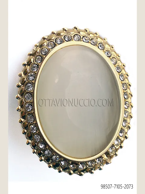 Knot holder with gold cameo and rhinestones