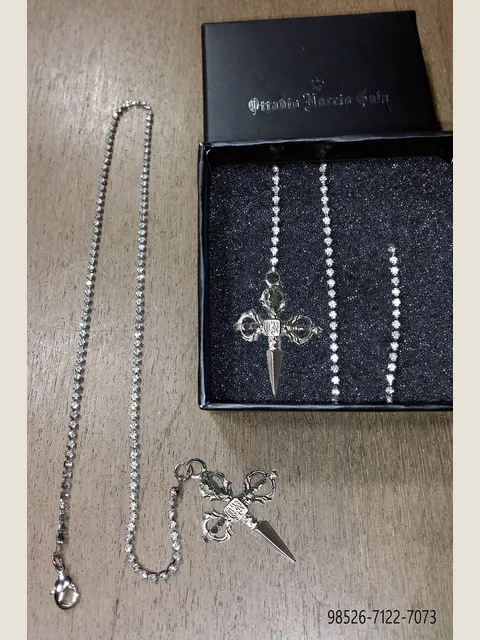 Chain with silver tone sword pendant