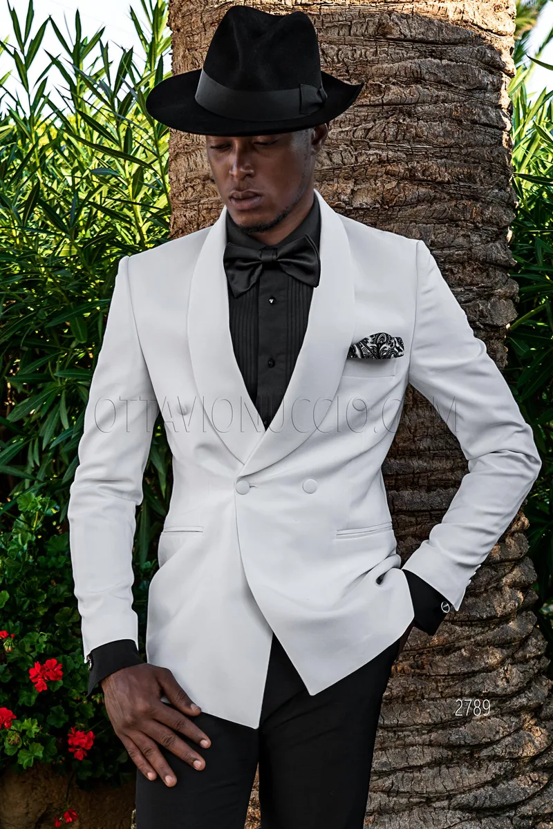 White double-breasted shawl lapel tuxedo jacket and black trousers – Three-quarter view