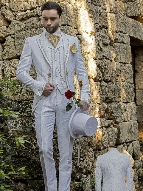 Luxurious groom suit in white damask with gold embroidery