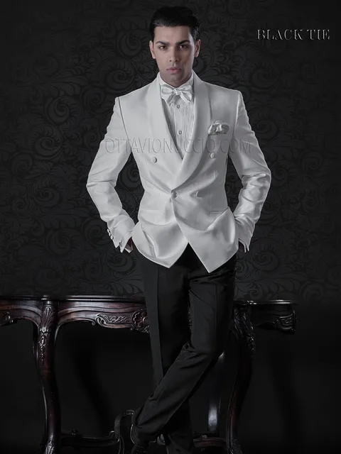 White tuxedo jacket with black formal trousers