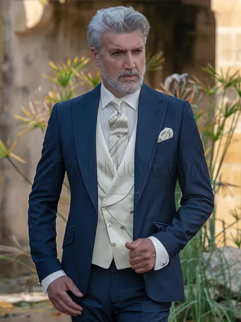 Fashion groom suit in blue with ivory waistcoat