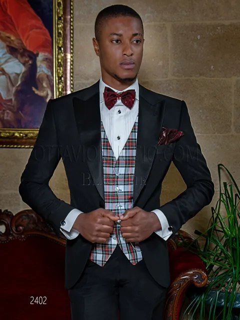 Tuxedo, elegant men's black suit with peak lapel
