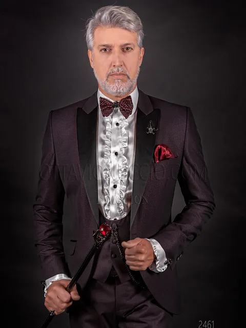 Modern men's wedding suit in burgundy with black peak lapel