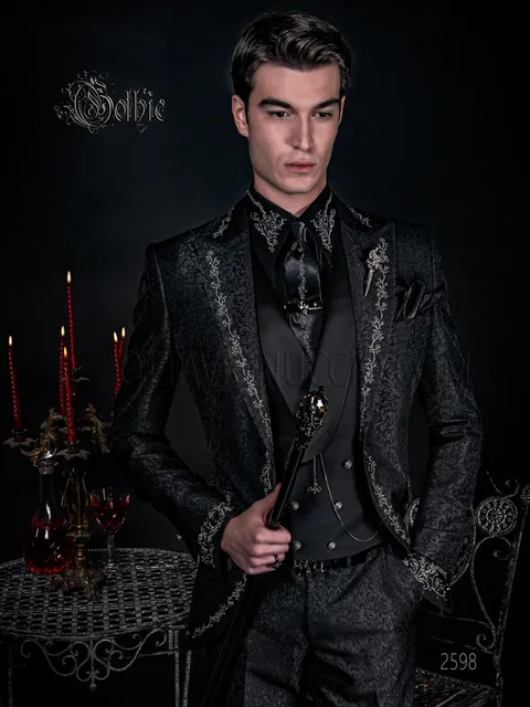 Gothic groom suit in black brocade with silver embroidery and frog fastening