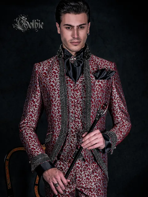 Gothic mandarin collar groom suit in red and silver brocade with crystal trimming