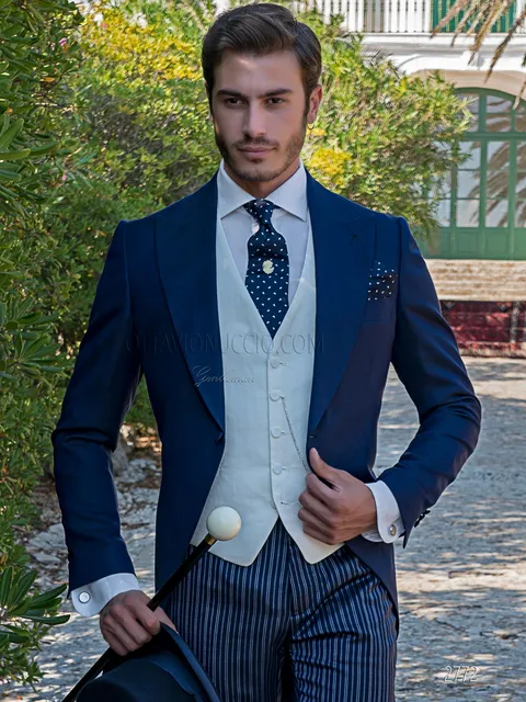 Modern blue half morning suit with classic striped trousers and white waistcoat