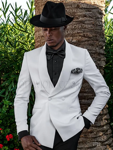 White double-breasted shawl lapel tuxedo jacket and black trousers