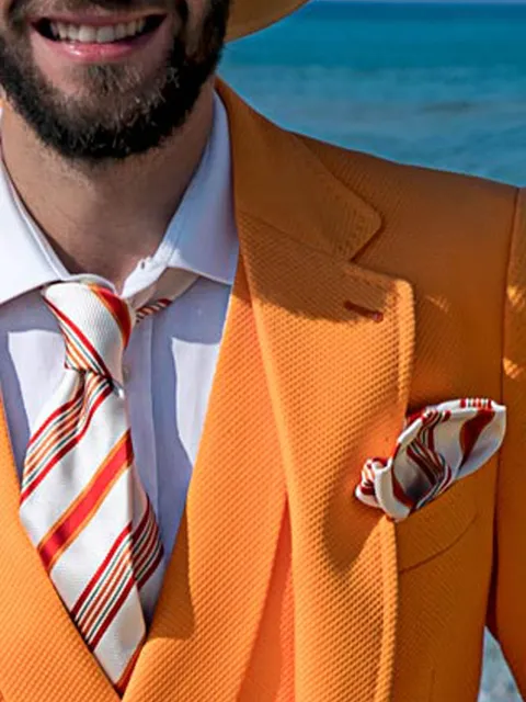 Tie and handkerchief in jacquard silk with orange stripes on a white background