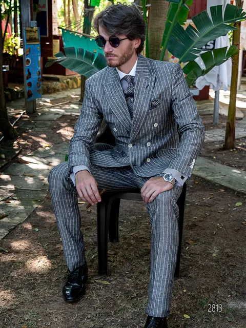 Men's elegant double-breasted suit in grey pinstripe linen with diplomatic stripe