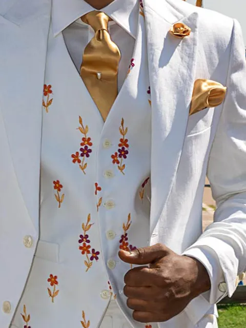 Waistcoat in white fine-ribbed fabric with raised floral embroidery