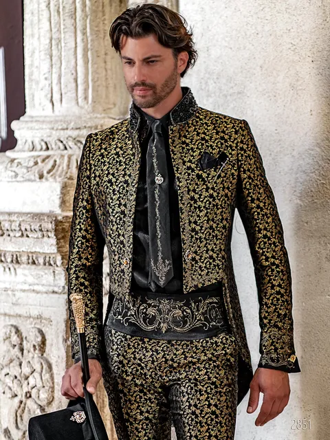 High fashion mandarin collar tailcoat in black and gold damask with golden Gothic embroidery