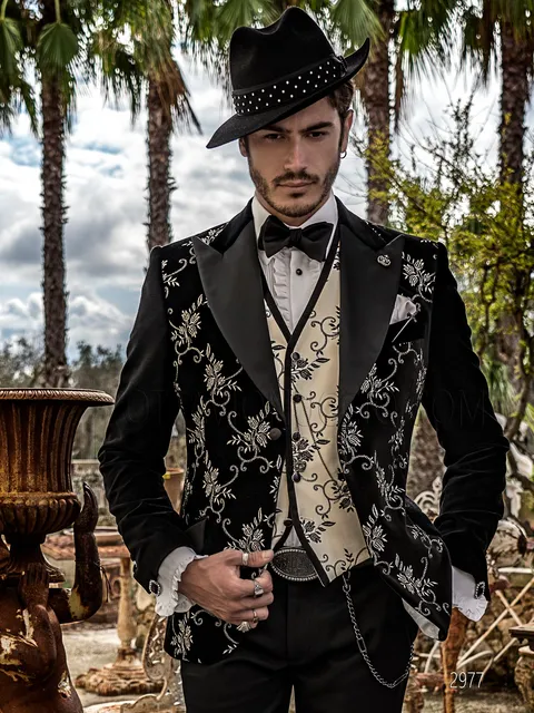 Men's distinctive black suit with light floral embroidery and black trousers