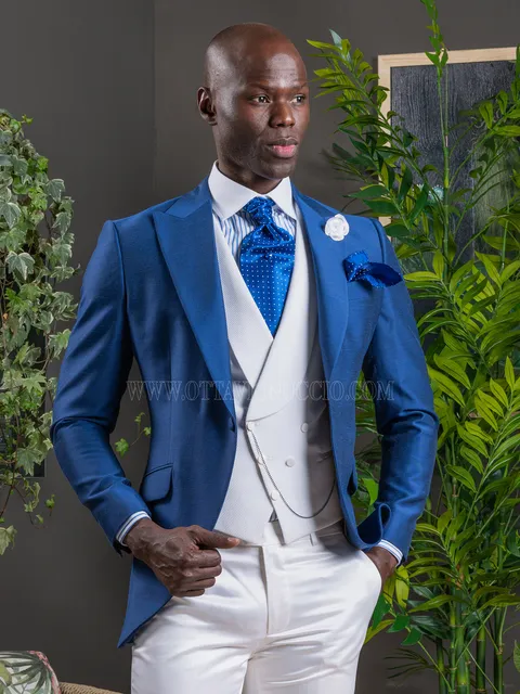 Men's royal blue formal suit with white waistcoat and trousers