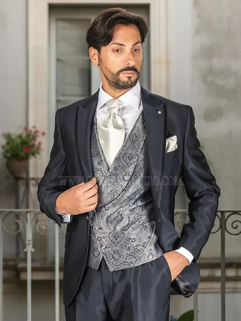 Groom suit in blue with piping on the lapel and damask waistcoat