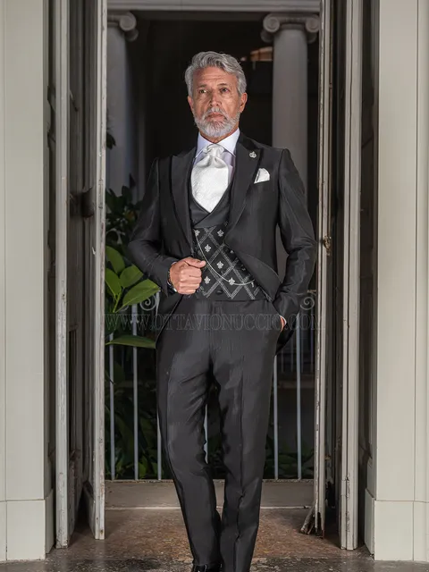 Black frock coat groom suit with piping on the lapel