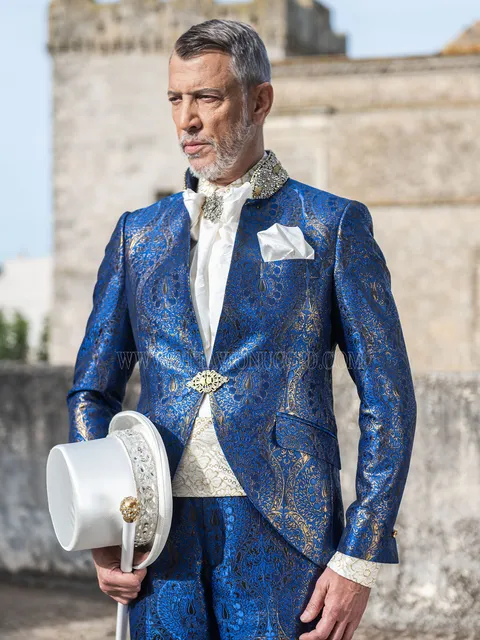 Groom suit with mandarin collar in blue and gold brocade with trimming