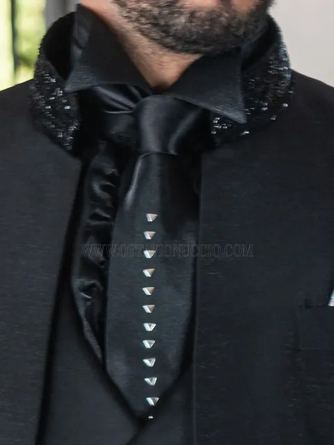 Tie in satin with metal appliqués