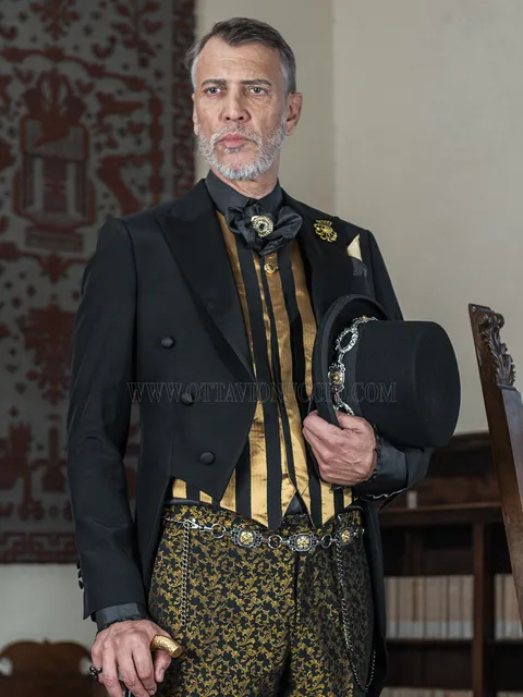 Men's black steampunk style groom tailcoat with black and gold damask trousers