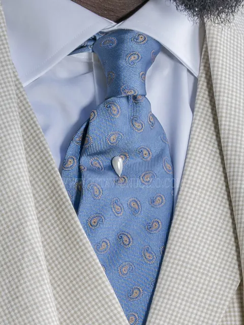 Tie in light blue silk jacquard with paisley patterns