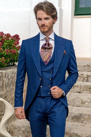 Tight da cerimonia con gilet doppiopetto in principe di galles blu